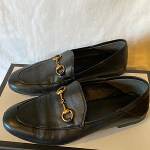 Gently worn, classic, black Gucci loafers.